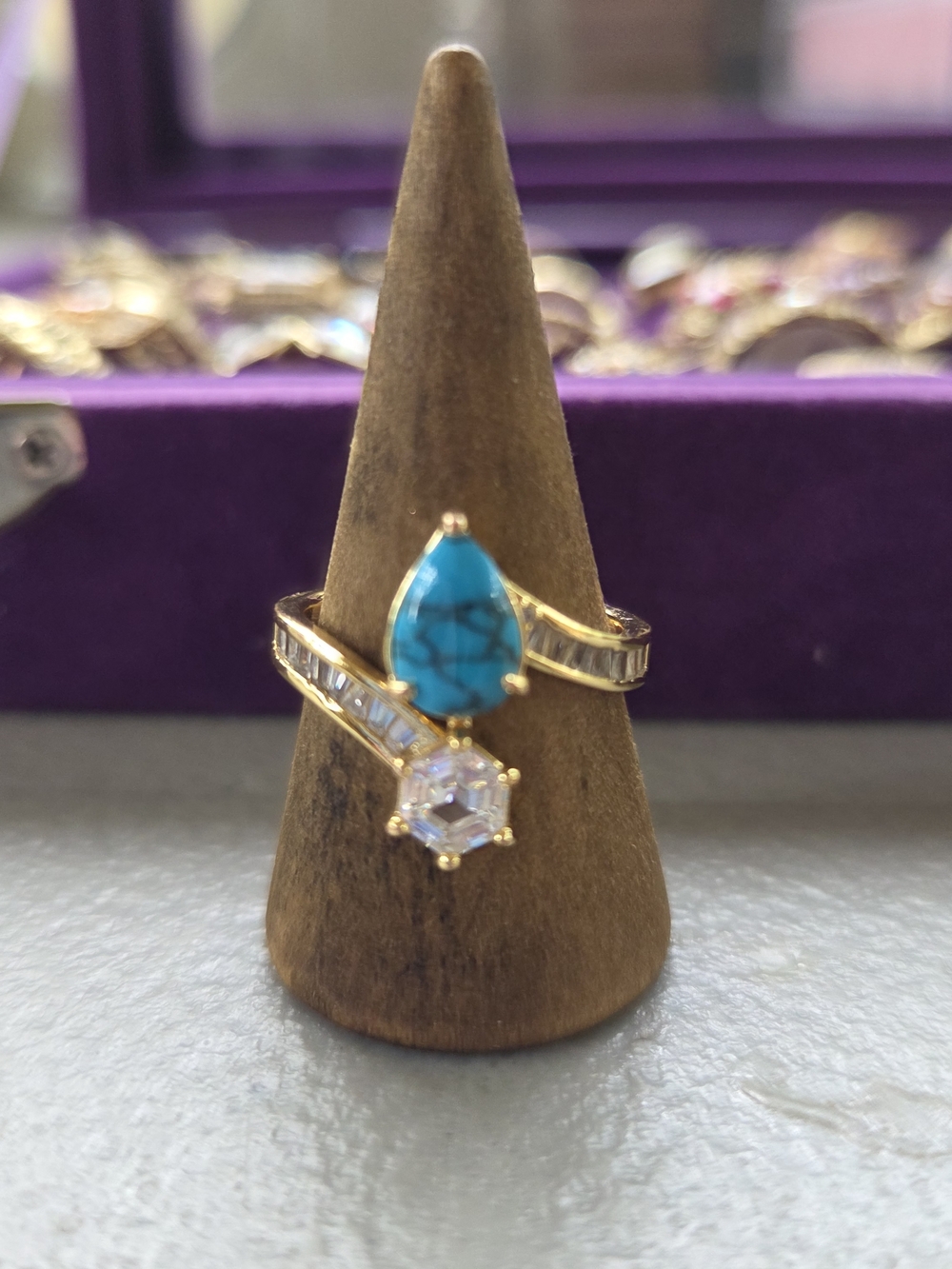 bp Gold Ring with Teardrop Turquoise and Clear Stone